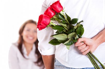 Man-Giving-Flowers-to-Woman